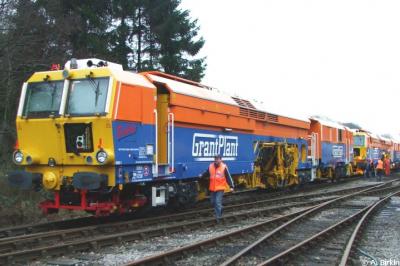 image showing a large yellow on-track machine