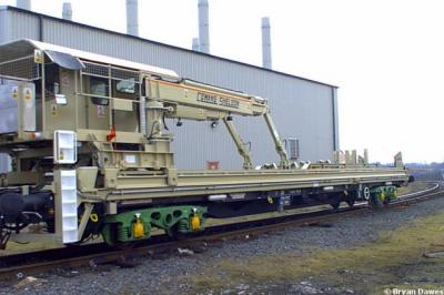 image showing a large yellow on-track machine