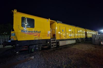 image showing a large yellow on-track machine