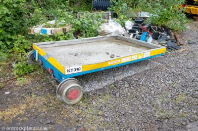 image showing a large yellow on-track machine